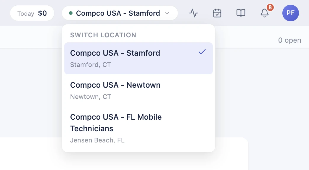 The BenchOS location switcher in light mode: switch between three Compco stores from one login